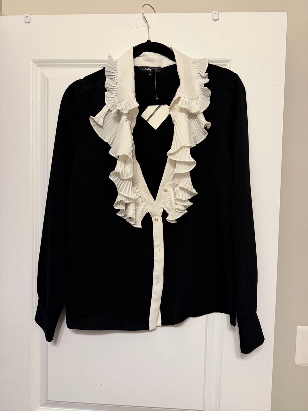 Black Button-Down Blouse with Ivory Ruffle Trim